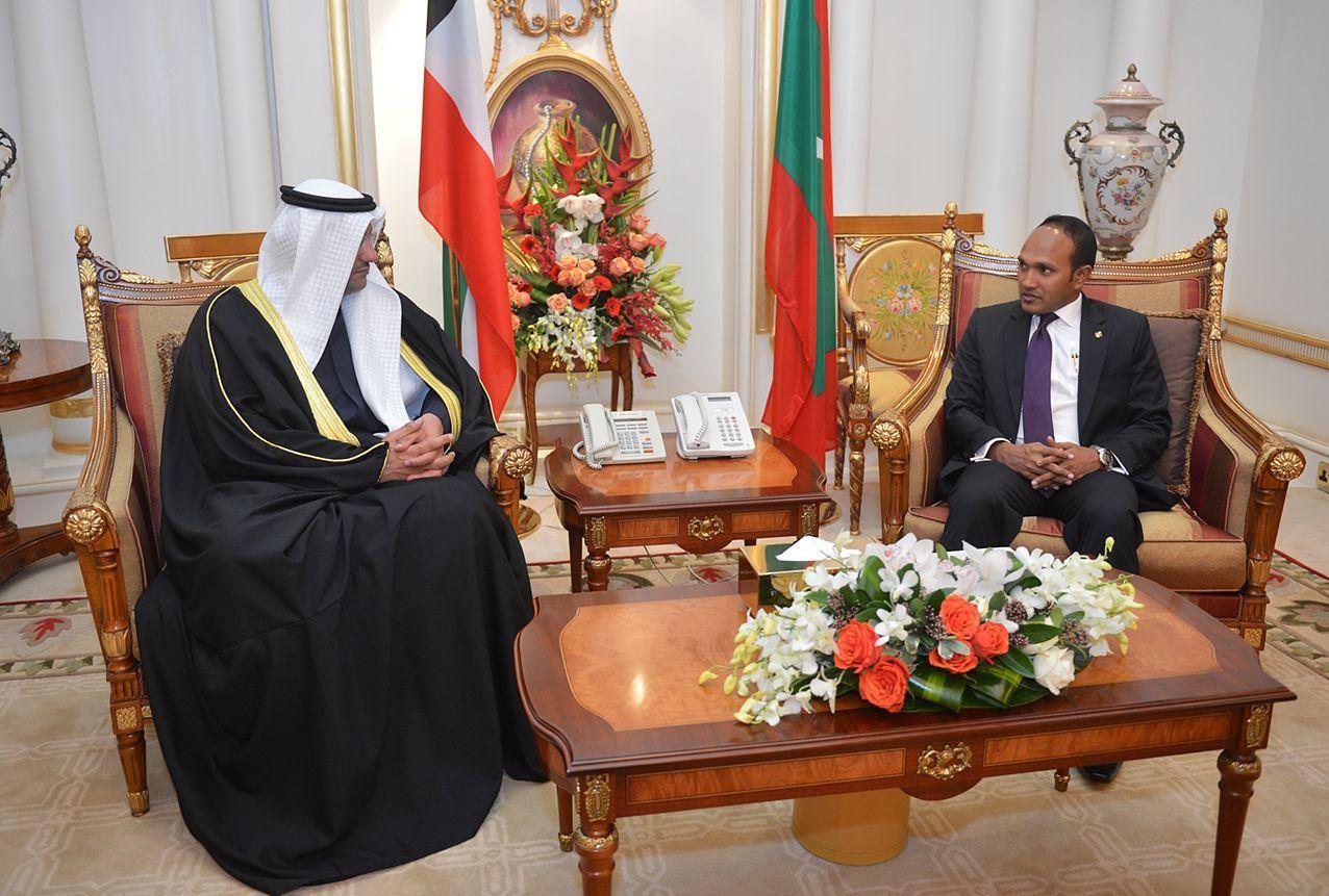Dr Jameel and his host seated either side of a low table, the Maldivian and Kuwaiti flags between them.
